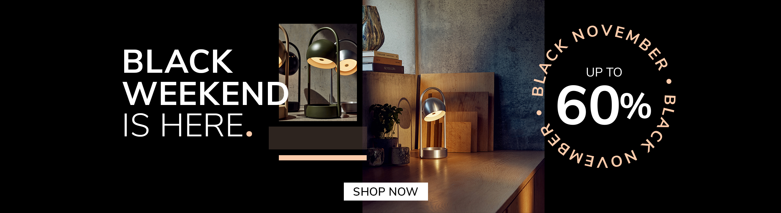 “Modern silver table lamp glowing on a wooden desk with cutting boards and plants in the background. Promotional text reads: ‘Black Weekend is here. Up to 60%. Black November.’ A button says ‘Save Now.